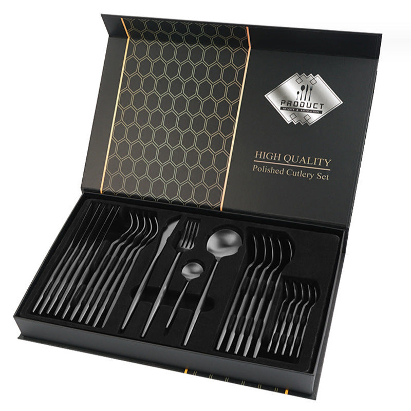 High-quality polished cutlery set in a black box with gold accents.
