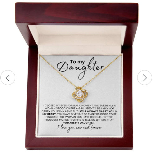 Gold necklace in a box with a sentimental message for a daughter