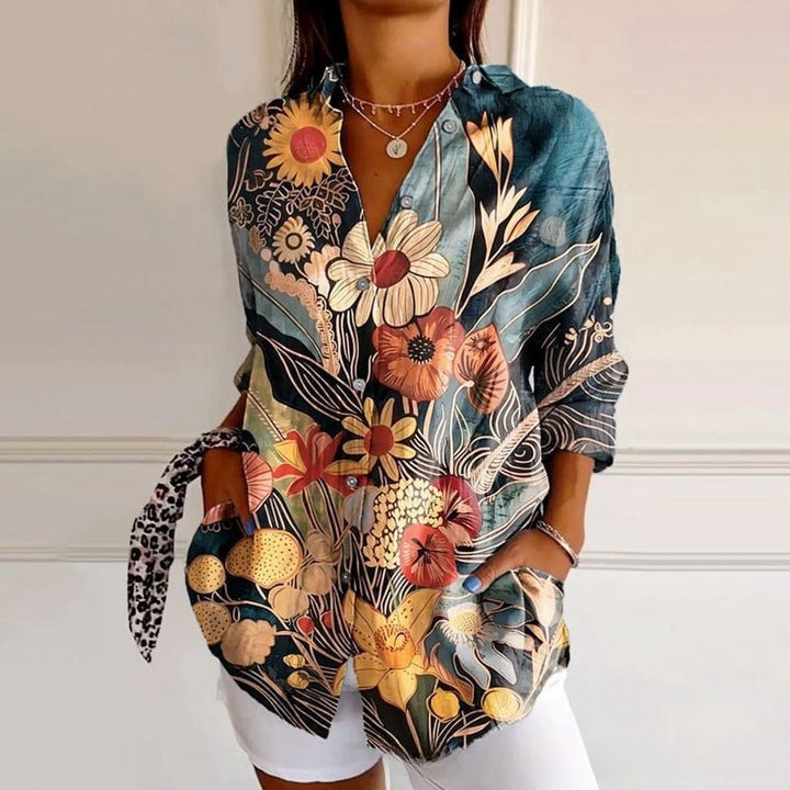Colorful floral patterned shirt worn by a person on a white background