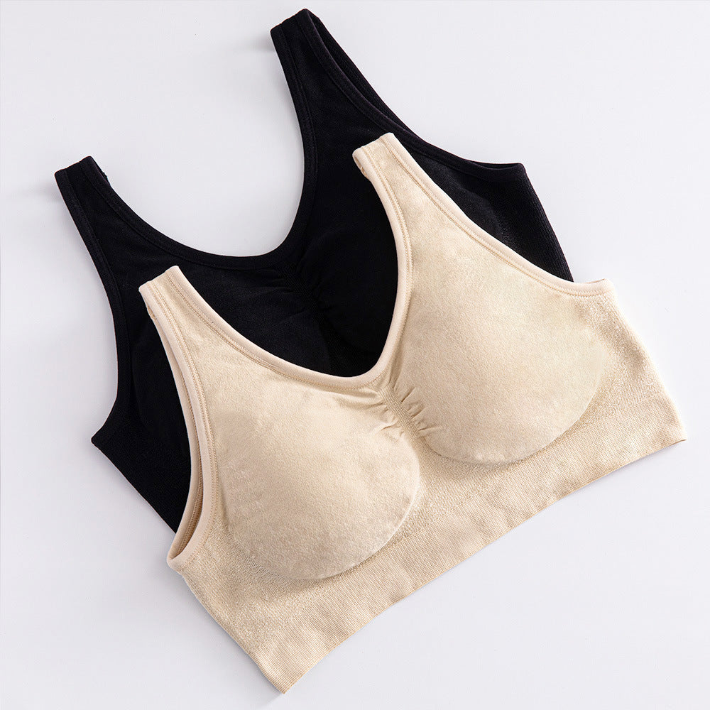 Black and beige bras on a white background