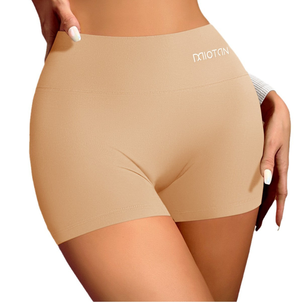 Beige shapewear shorts with a brand logo on a white background