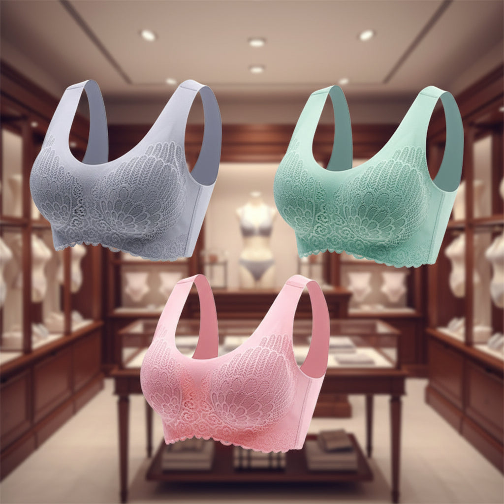 Three lace-trimmed bras in gray, pink, and green on a white background