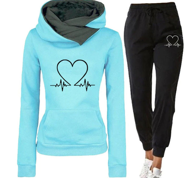 Light blue hoodie and black pants with heart design on a white background
