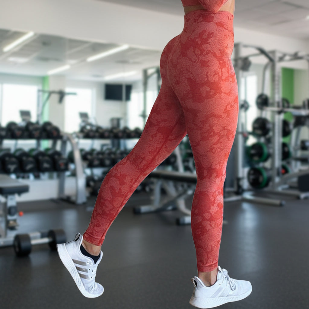 Red patterned leggings worn by a person on a white background