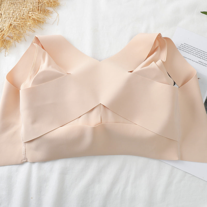 Beige strapless top on a white surface with a textured background