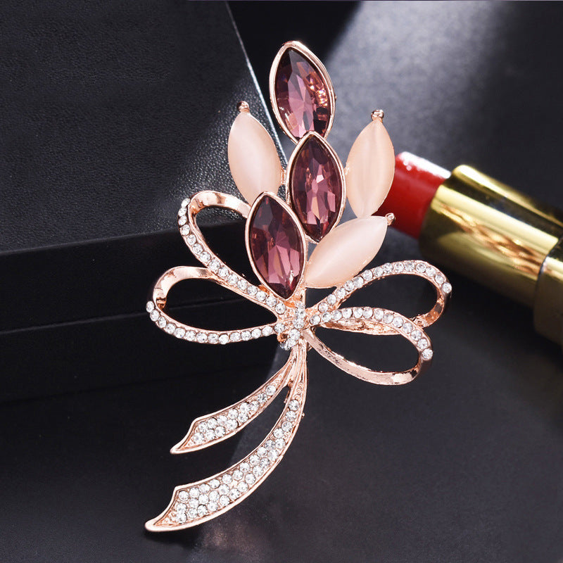 Decorative brooch with gemstones on a dark background