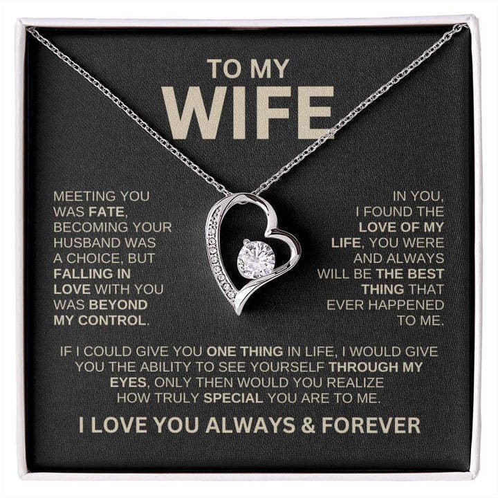 Heart-shaped necklace in a gift box with sentimental message for a wife