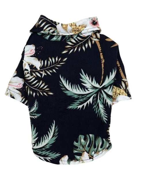 Dog hoodie with tropical leaf pattern on a white background