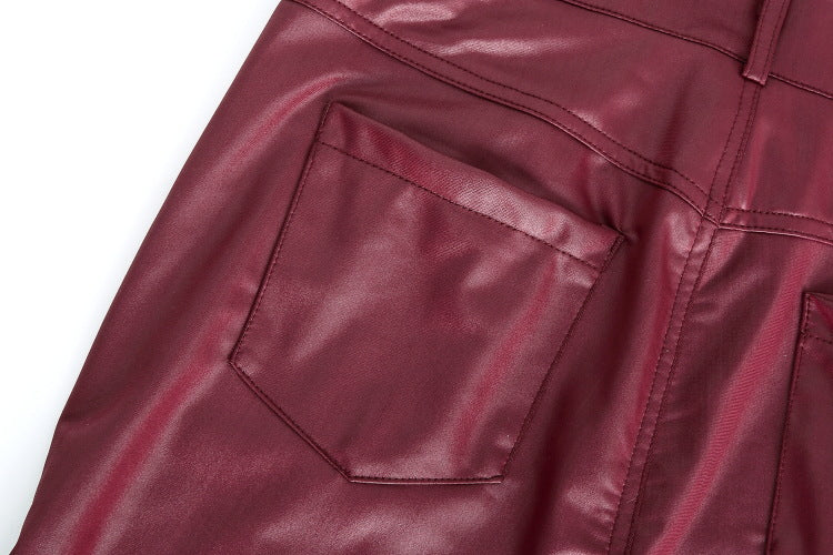 Close-up of a maroon leather jacket with a pocket on a white background