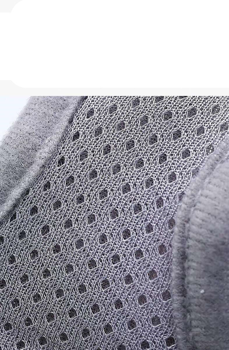 Close-up of a gray textured fabric with a subtle pattern on a white background