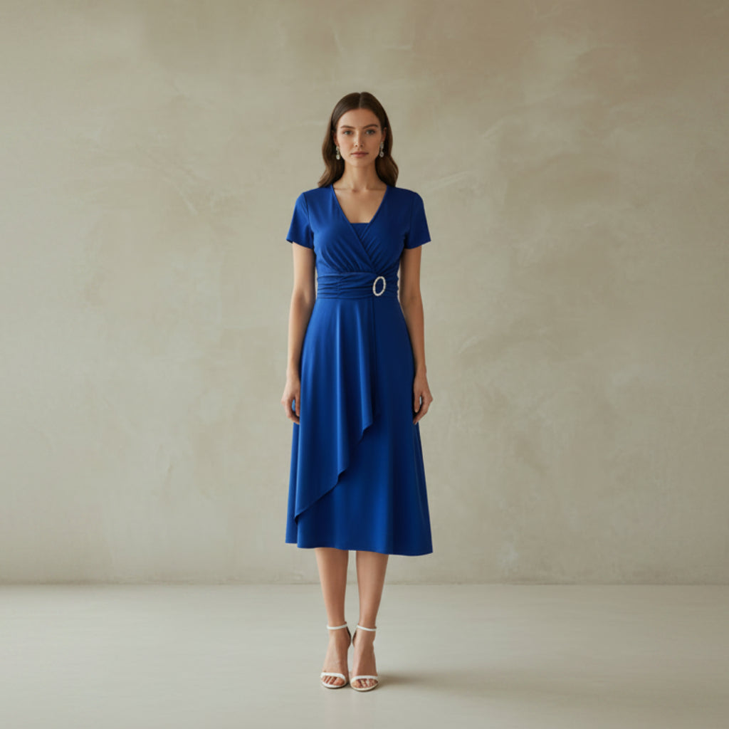 Woman wearing a blue dress with a white background