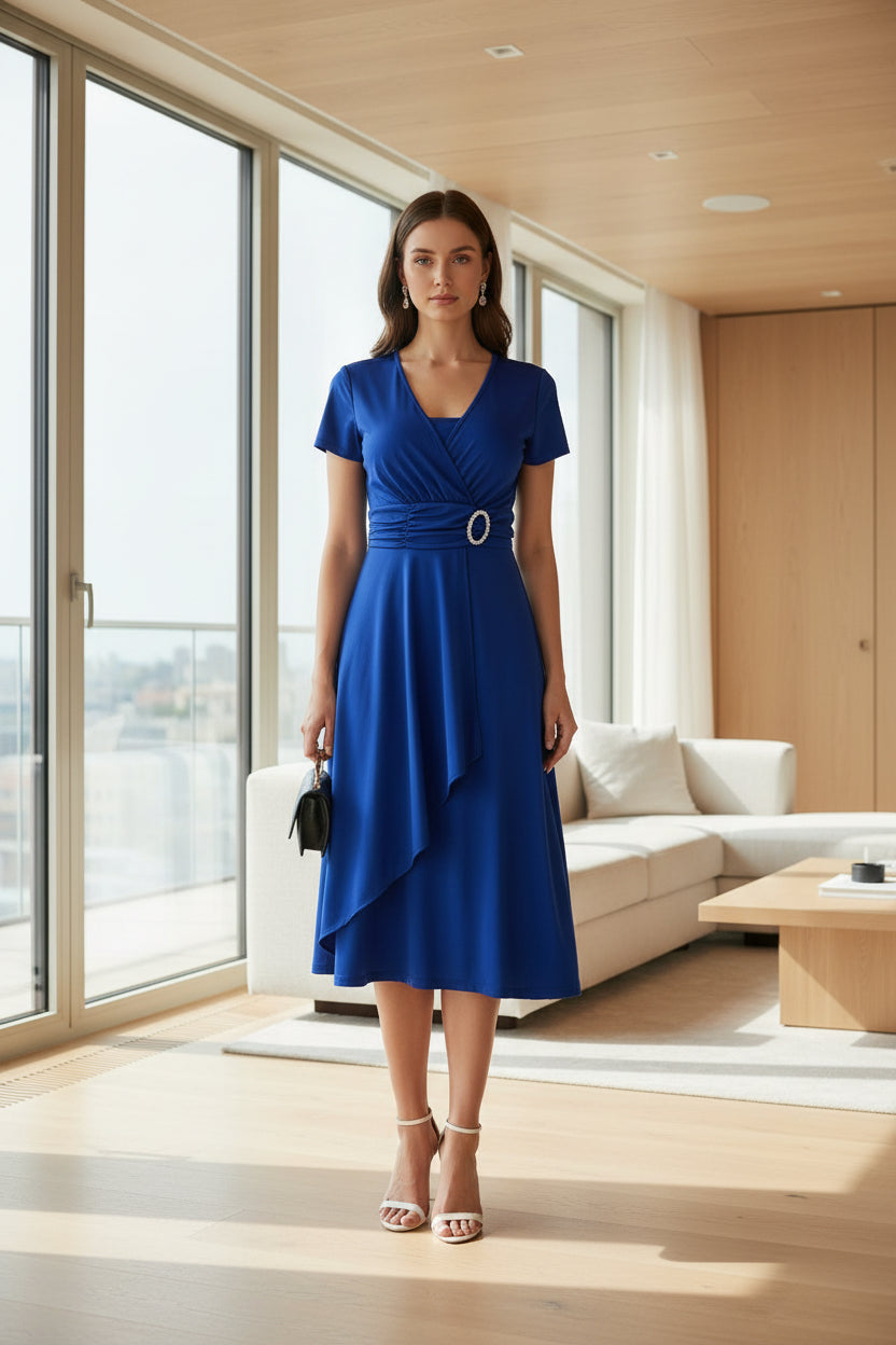 Woman wearing a blue dress with a white background