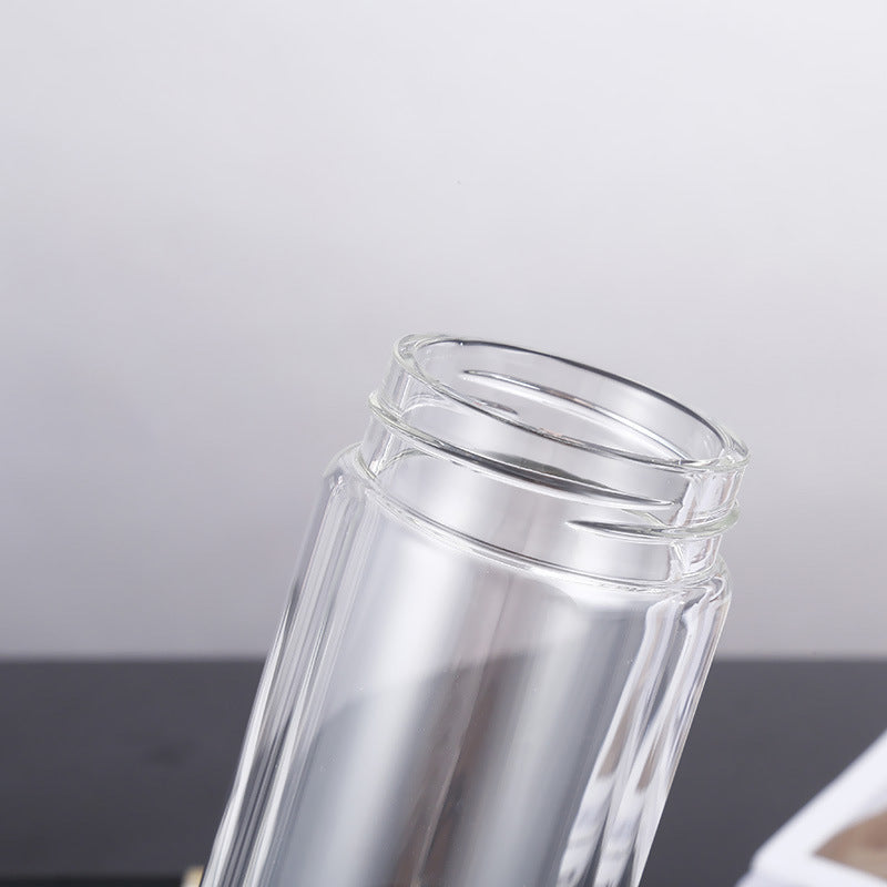 Clear glass tumbler with a white background