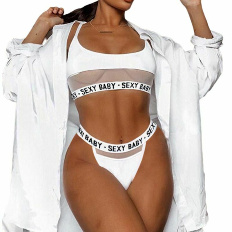 Person wearing a white 'SEXY BABY' lingerie set with a sheer overlay.