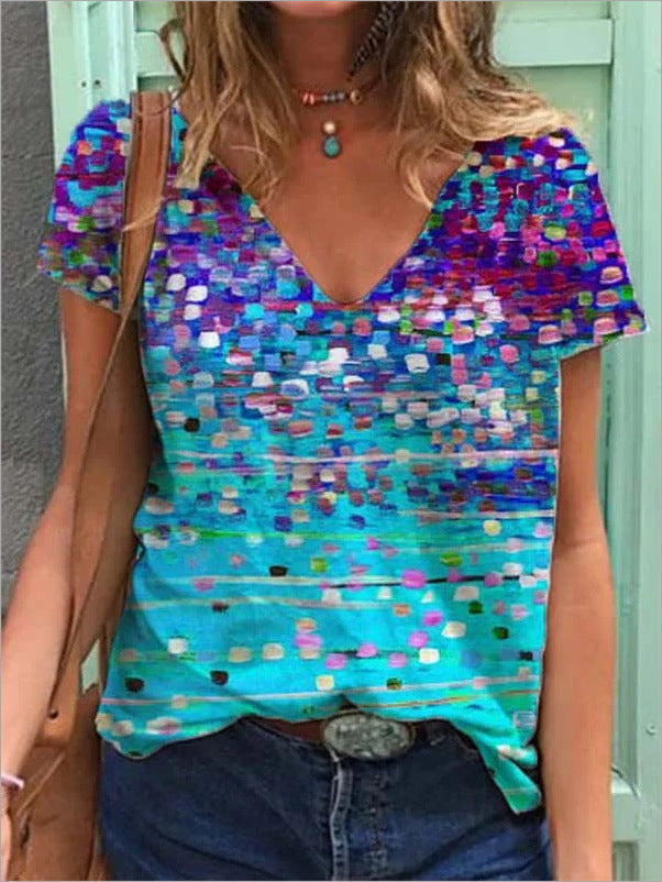 Multicolored patterned top worn by a person with a neutral background