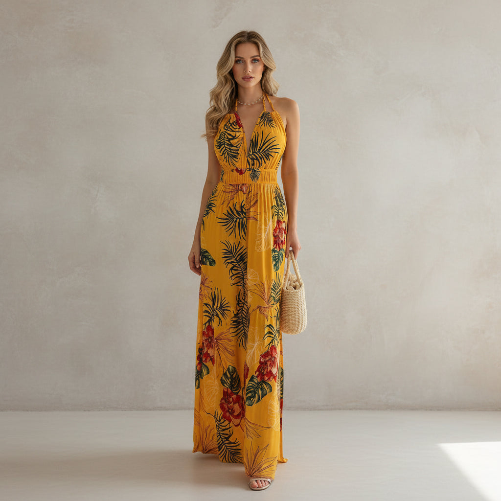 Woman wearing a yellow floral dress against a plain background