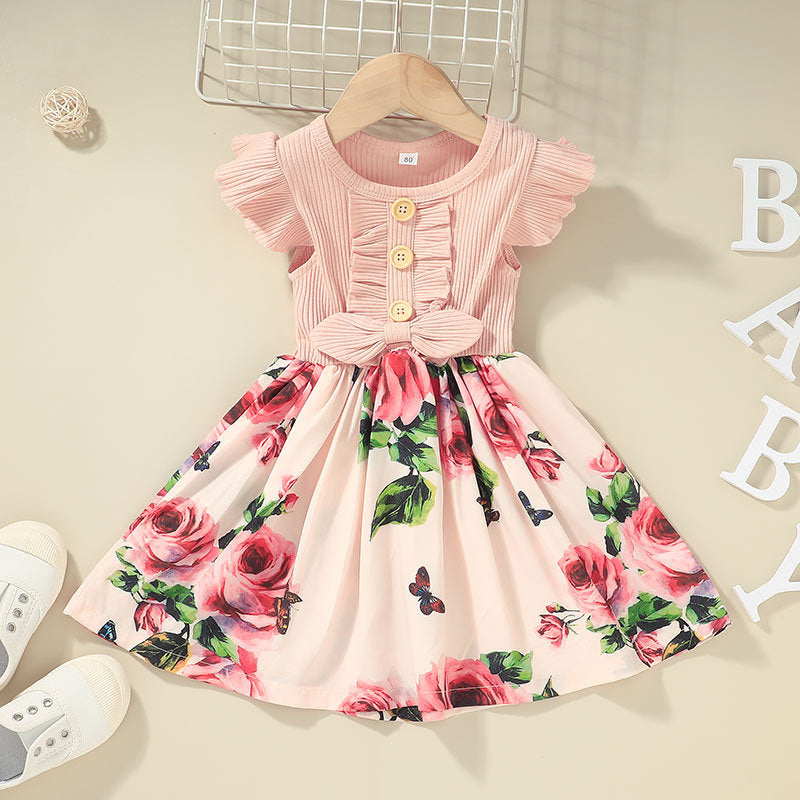 Floral dress with ruffled sleeves on a hanger against a neutral background