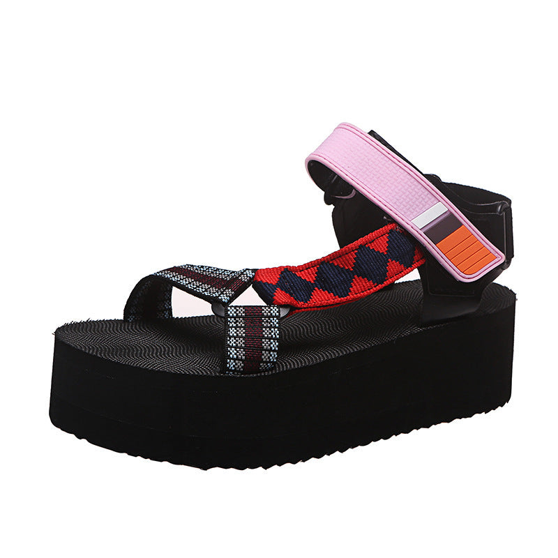 Black sandal with colorful strap on a white background