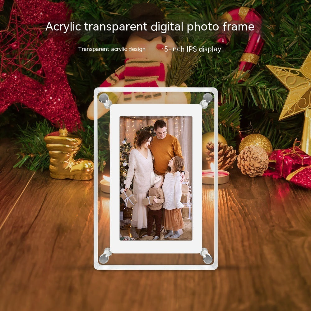Acrylic transparent digital photo frame displaying a family photo in front of a decorated Christmas tree.