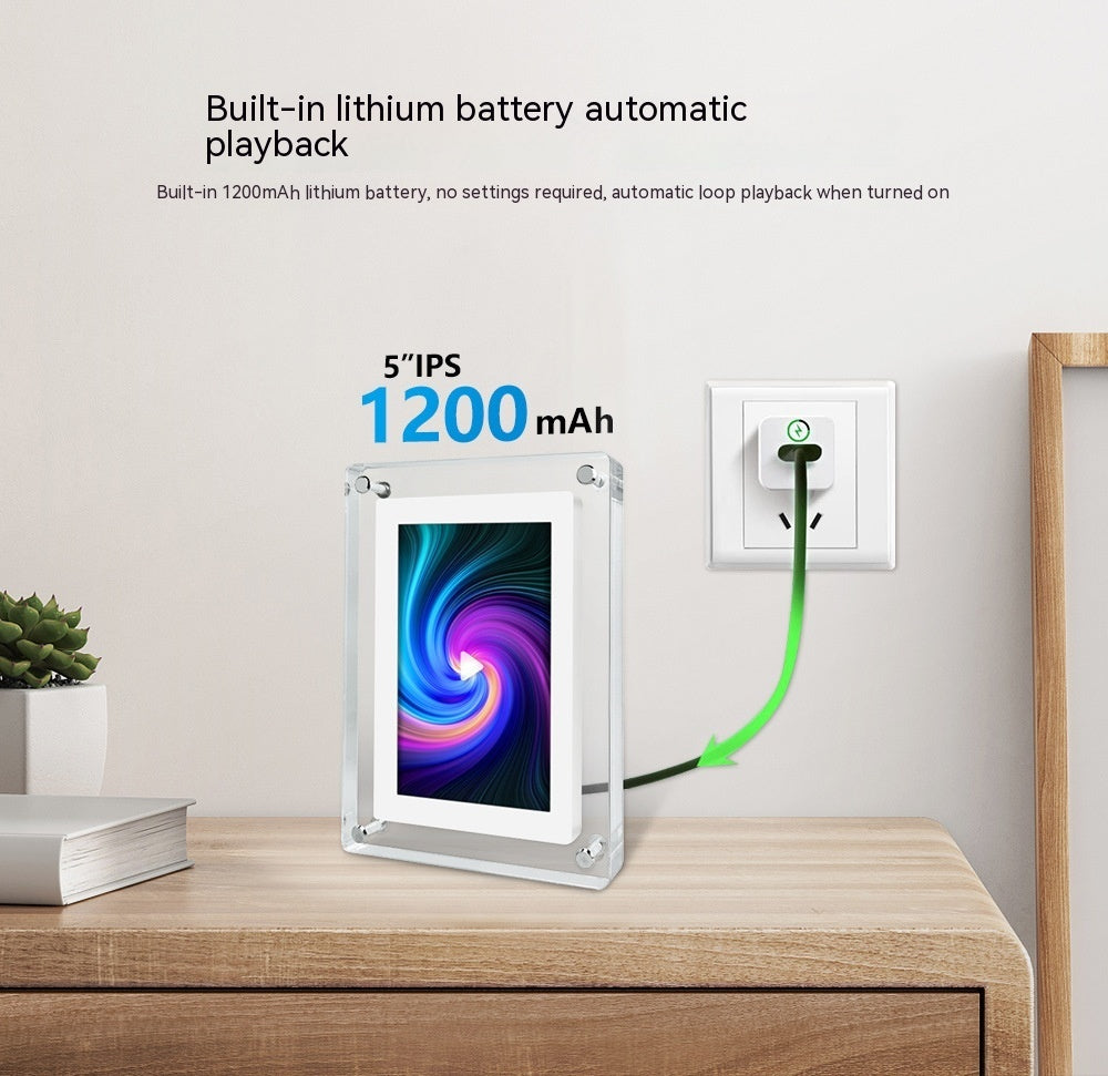 Digital photo frame with built-in lithium battery on a wooden surface, plugged into an outlet.