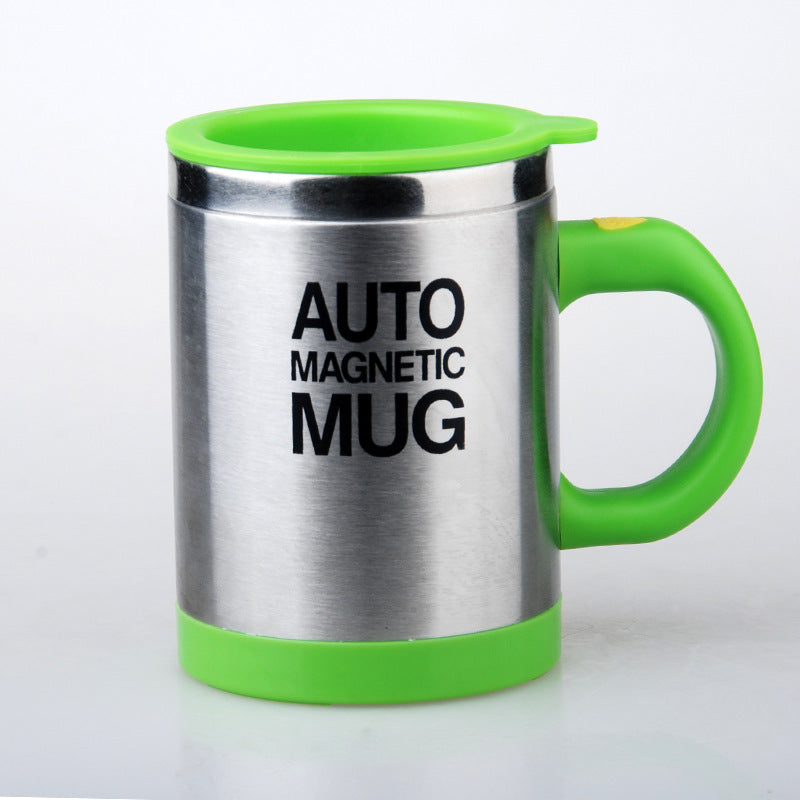 Stainless steel mug with green handle and rim on a white background