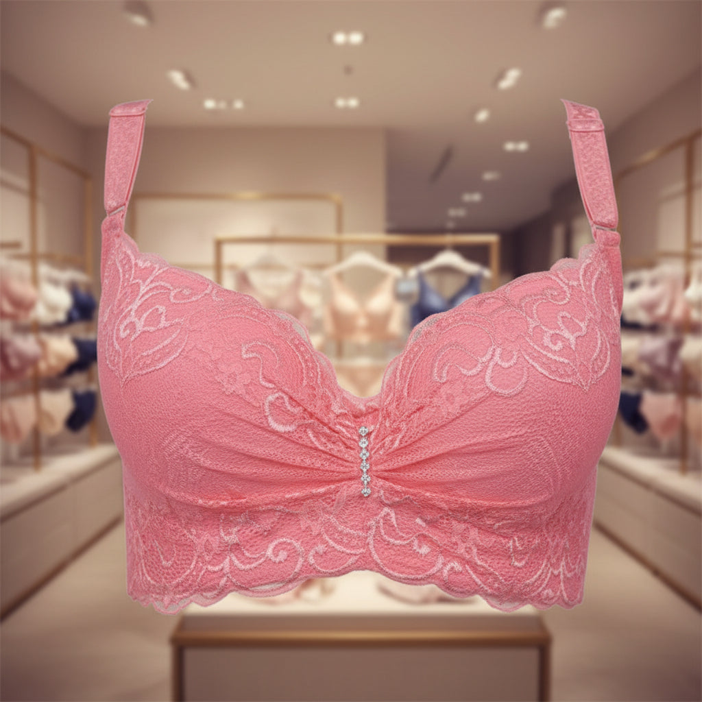 Pink bra with lace details on a white background