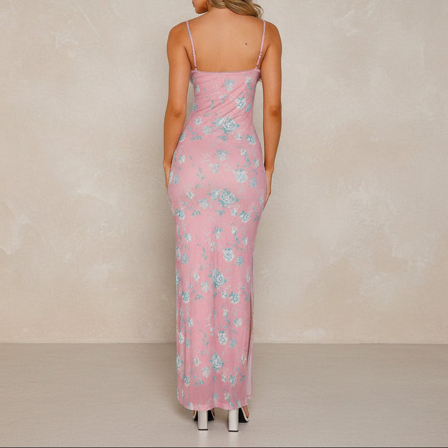 Woman wearing a pink floral dress on a white background