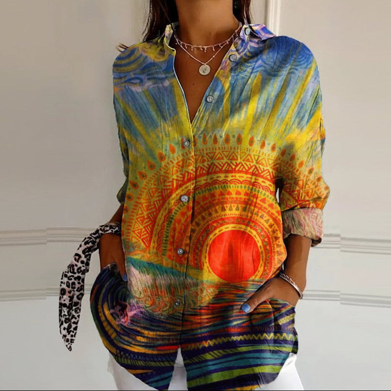 Colorful tie-dye shirt worn by a person against a neutral background