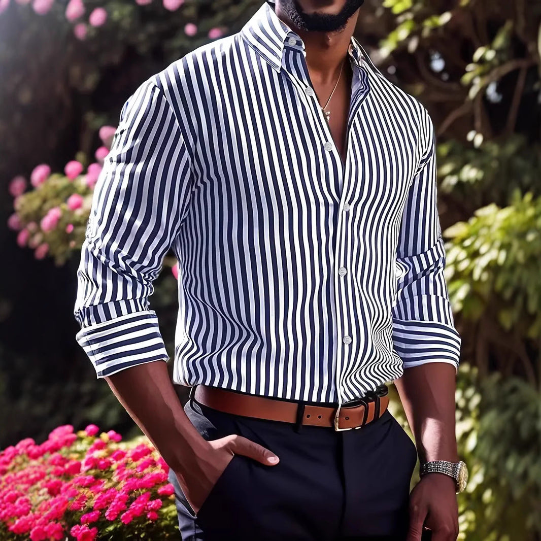 Person wearing a blue and white striped shirt with a blurred floral background