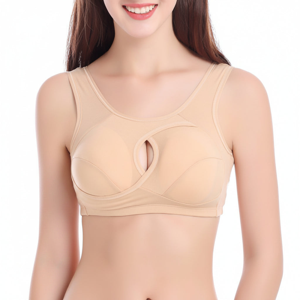 Woman wearing a beige bra on a white background
