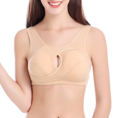 Woman wearing a beige bra on a white background