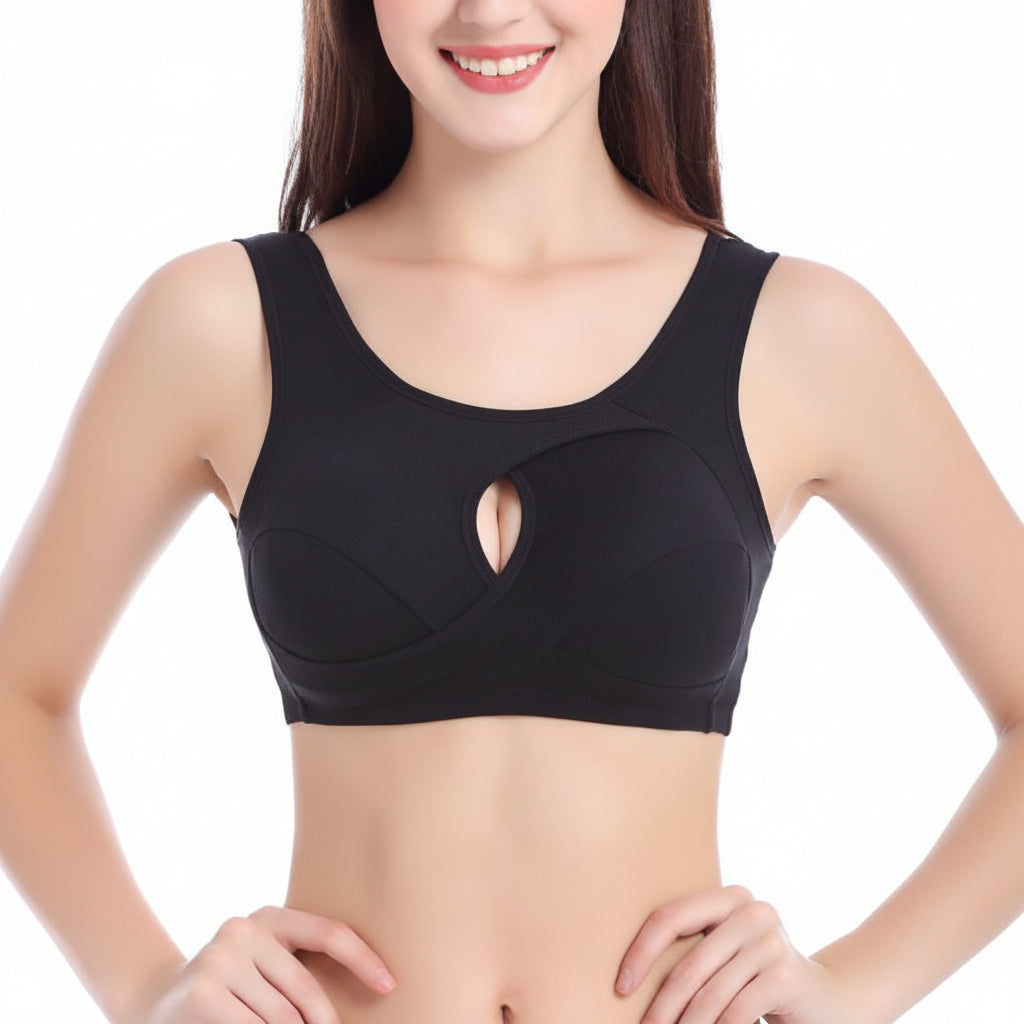 Woman wearing a black sports bra on a white background