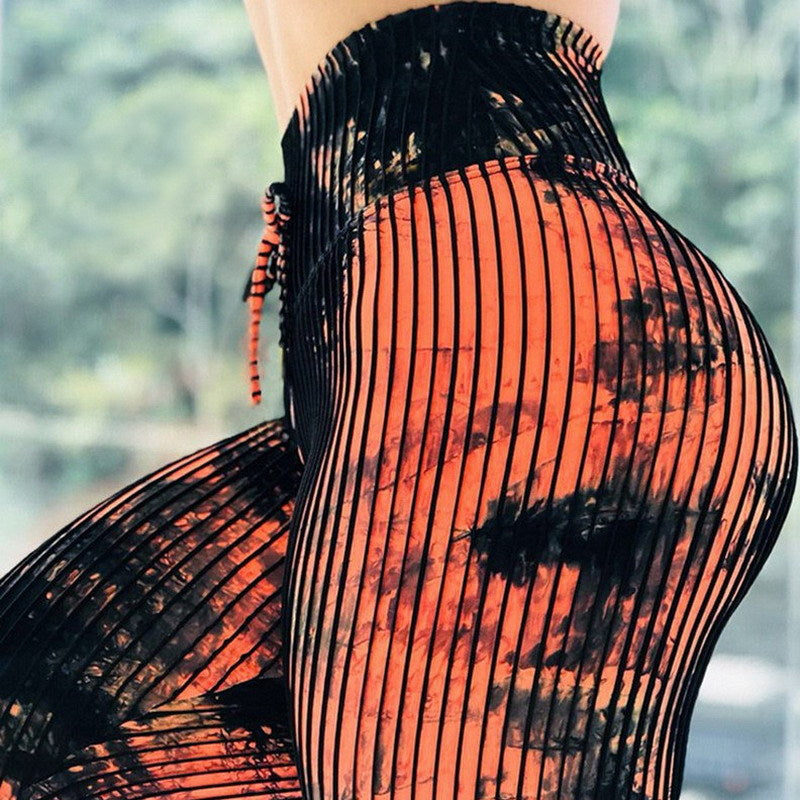 Black and orange striped pants with a blurred background