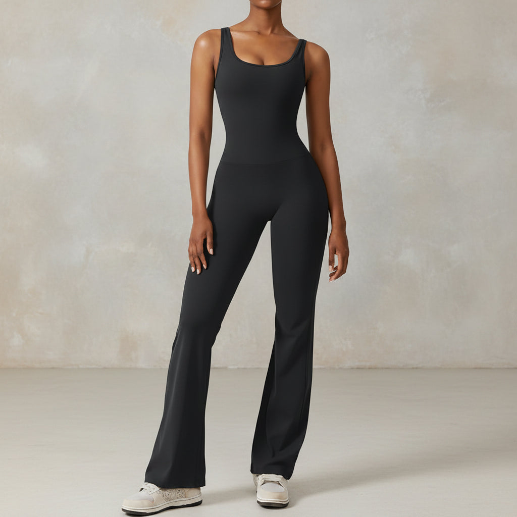 Person wearing a black jumpsuit on a white background