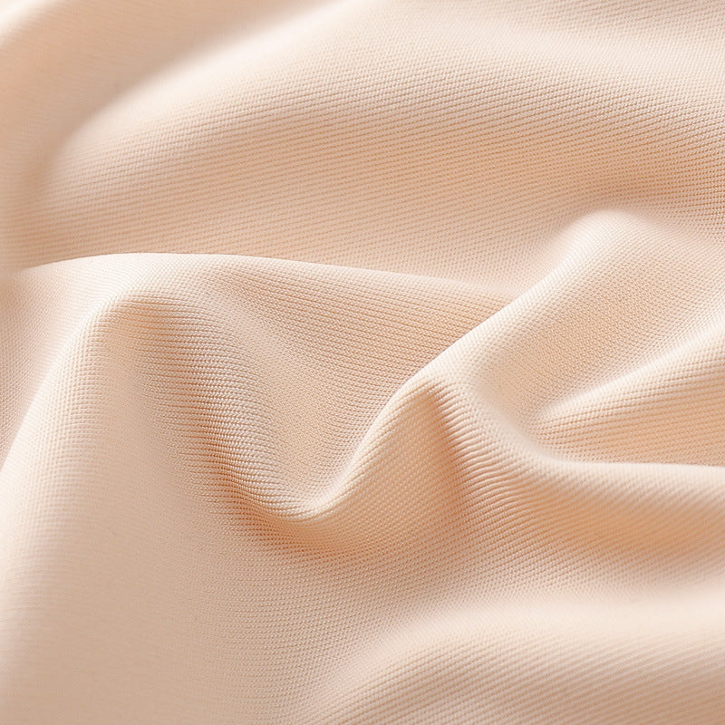 Close-up of beige fabric with soft folds