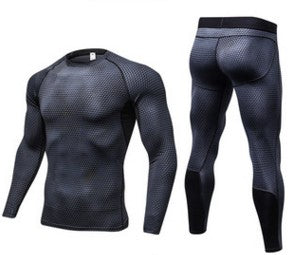 Black long-sleeve athletic shirt and leggings set on a white background