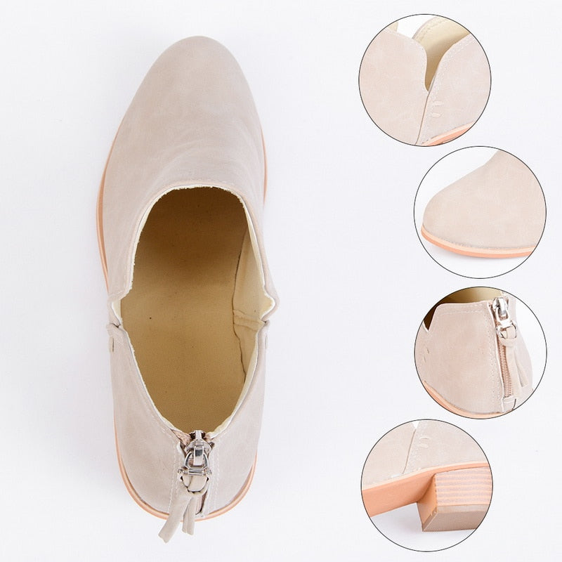 Beige flat shoe with close-up details on a white background