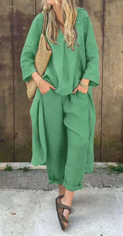 Person wearing a green outfit with a wooden background