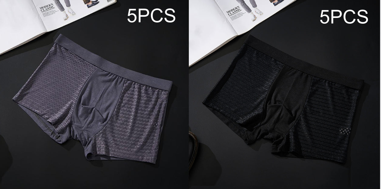 Two pairs of men's underwear, one gray and one black, on a dark surface with '5PCS' text above each pair.