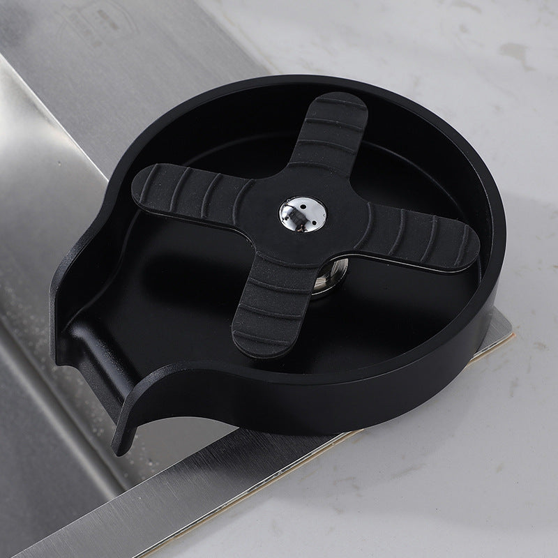 Black kitchen knife sharpener on a gray surface