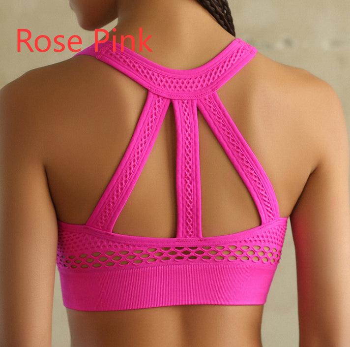 Rose pink sports bra with open back design on a neutral background