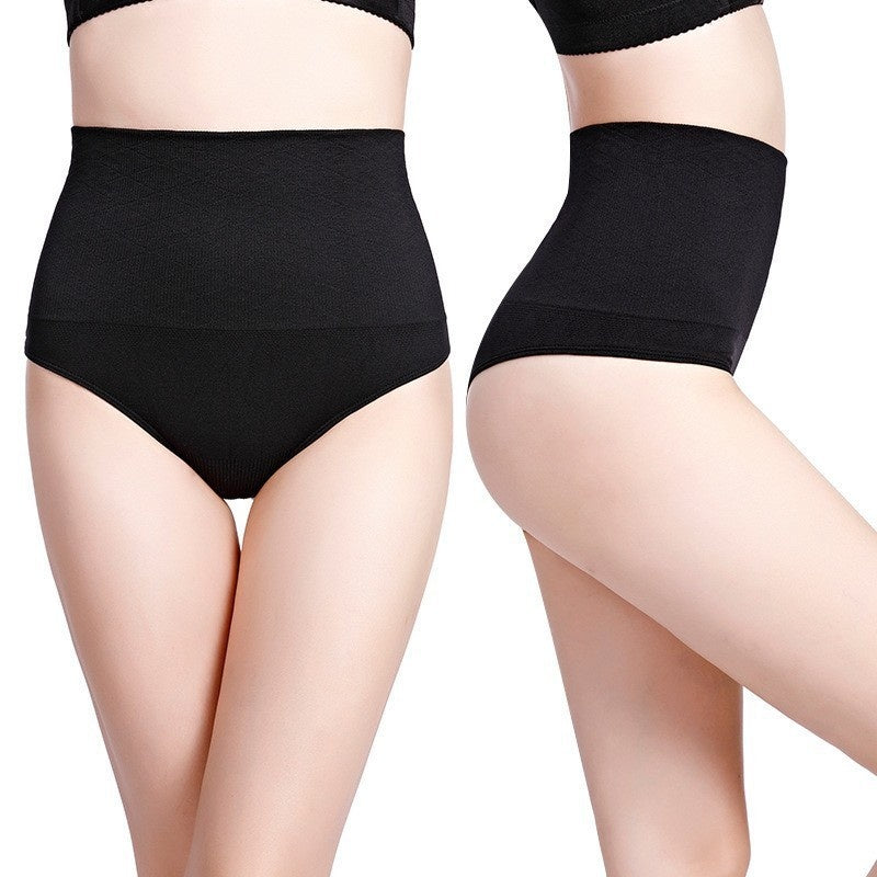 Black high-waisted underwear worn by a person on a white background