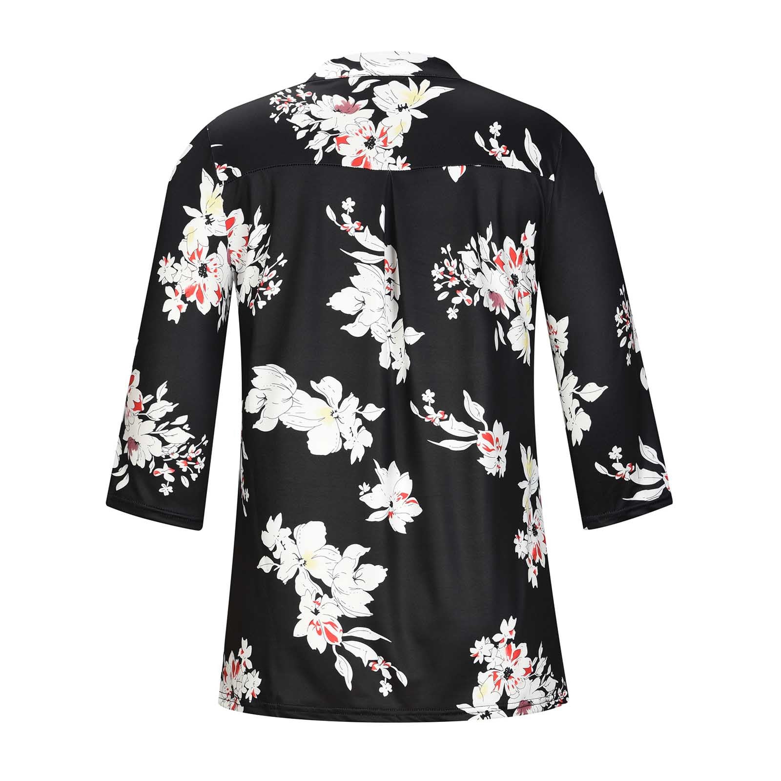 Black dress with white floral pattern on a white background