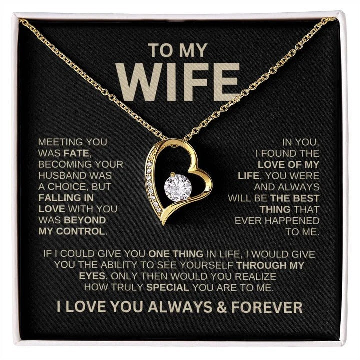 Gold heart-shaped necklace with a diamond on a card for a wife, featuring sentimental text.
