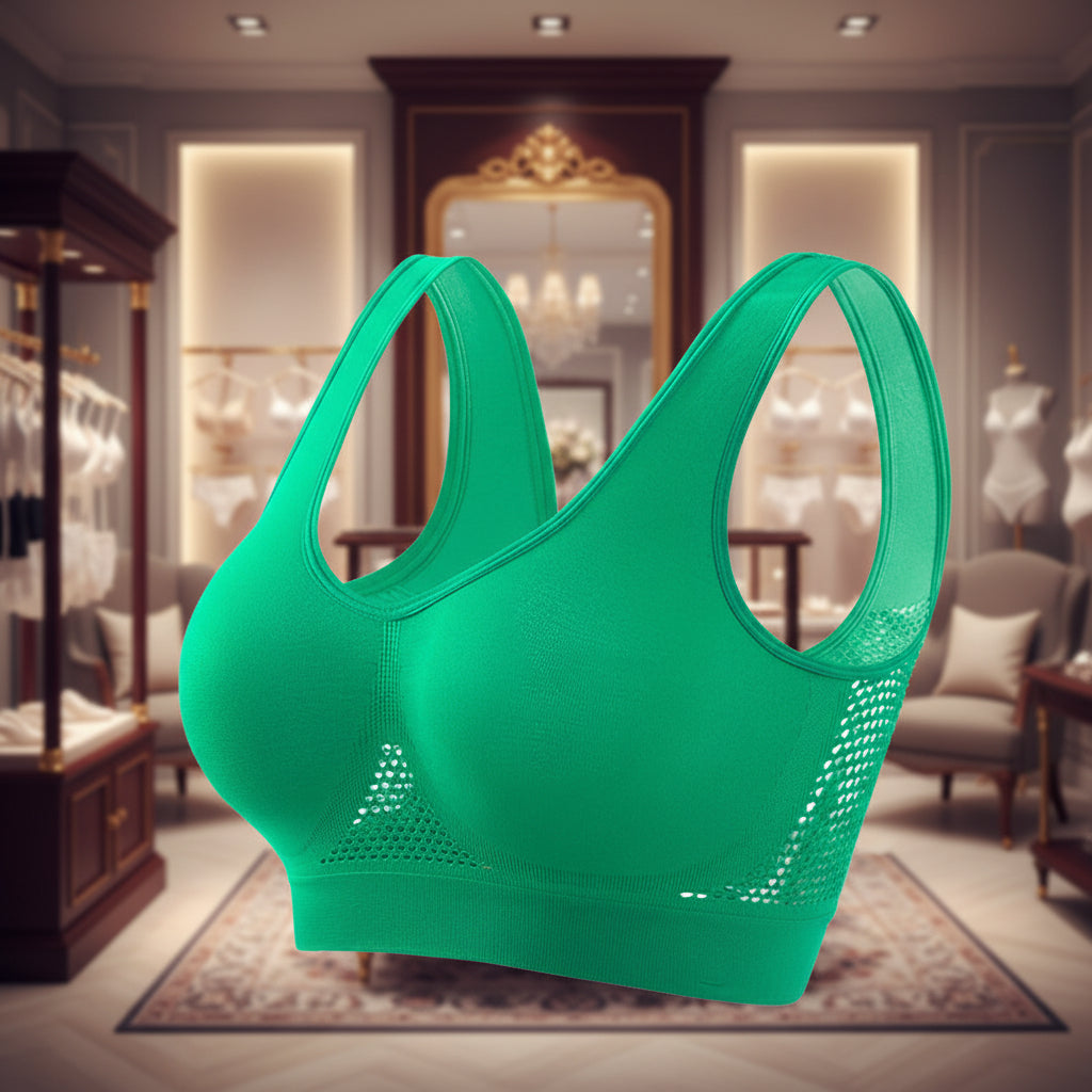 Green sports bra with mesh panels on a white background