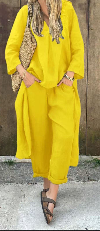 Person wearing a yellow outfit with a wooden background