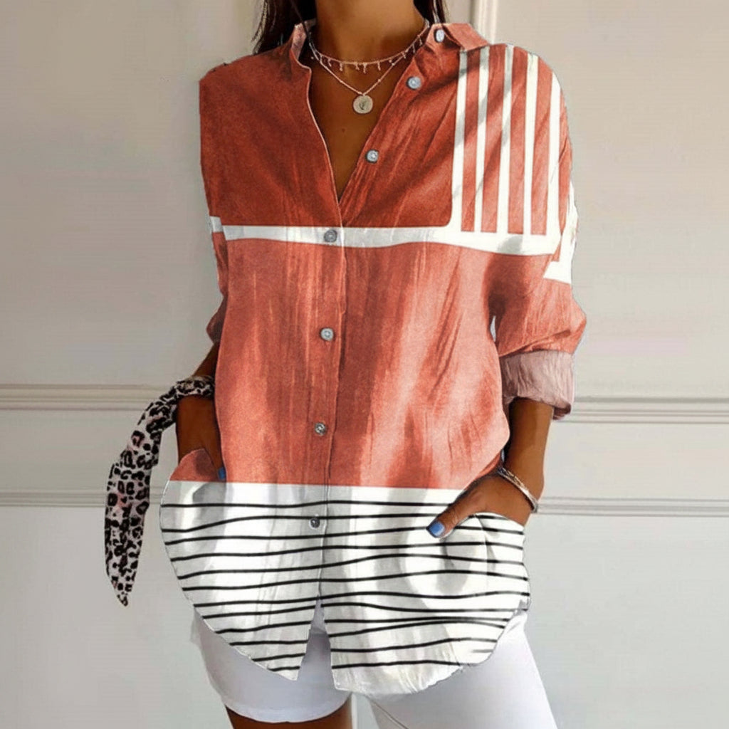 Person wearing a red and white striped shirt with a white background