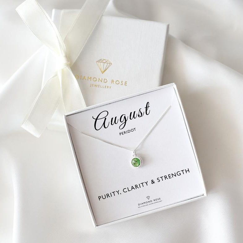 Diamond Rose jewelry box with an August birthstone necklace on a white background