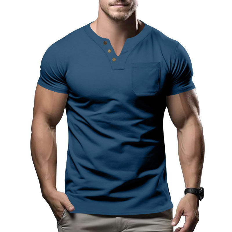Man wearing a blue henley shirt with a white background
