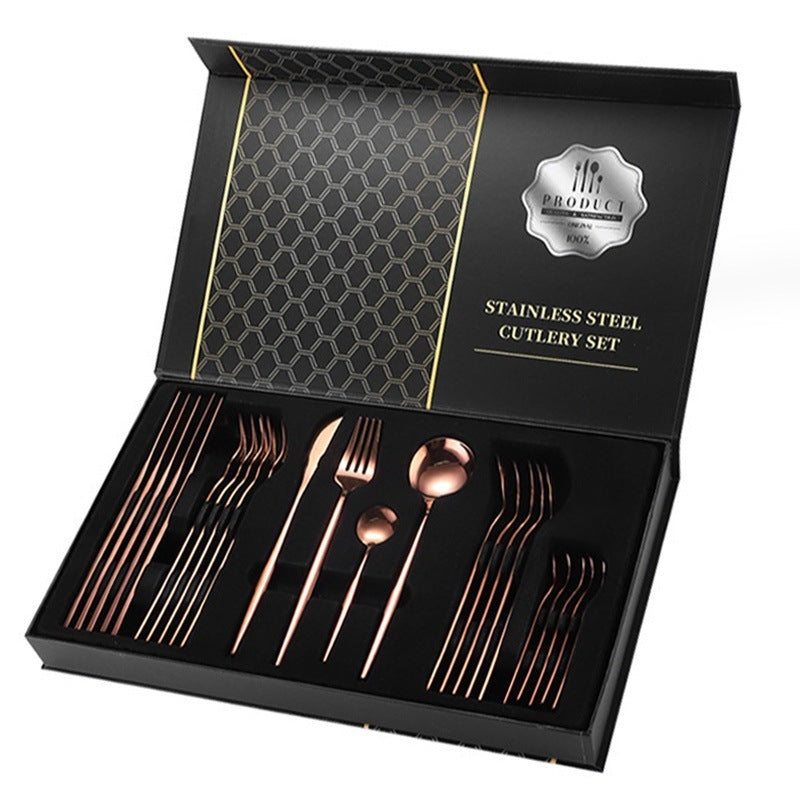 Rose gold cutlery set in a black box with 'The Product' branding.